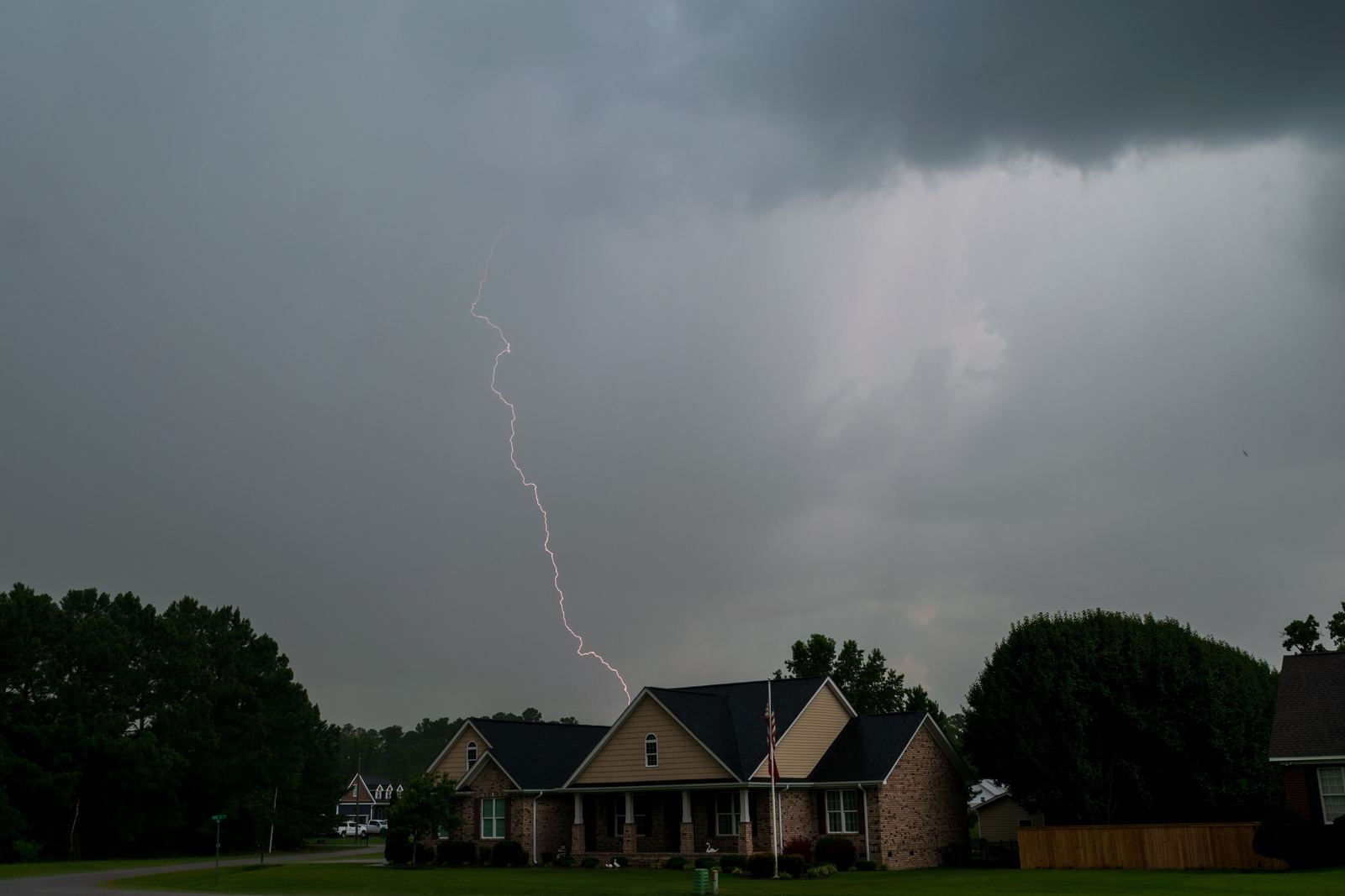 Storm clouds building over homes